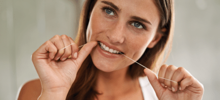 Woman flossing