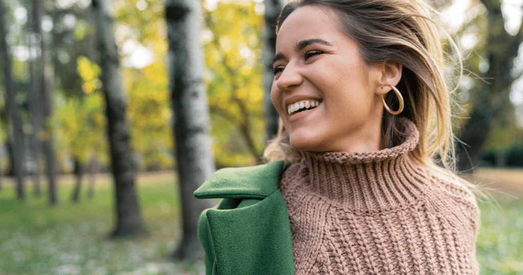 woman smiling during the holidays.