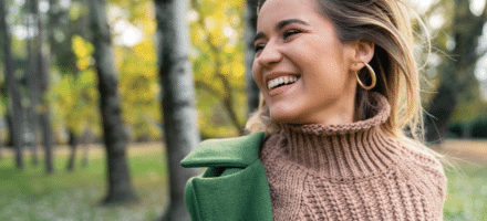 woman smiling during the holidays.